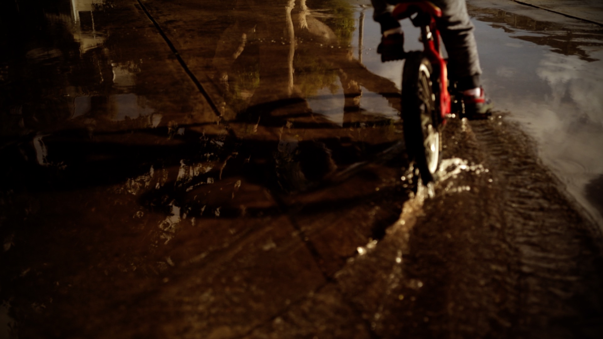 a boy's face while he rides his bike