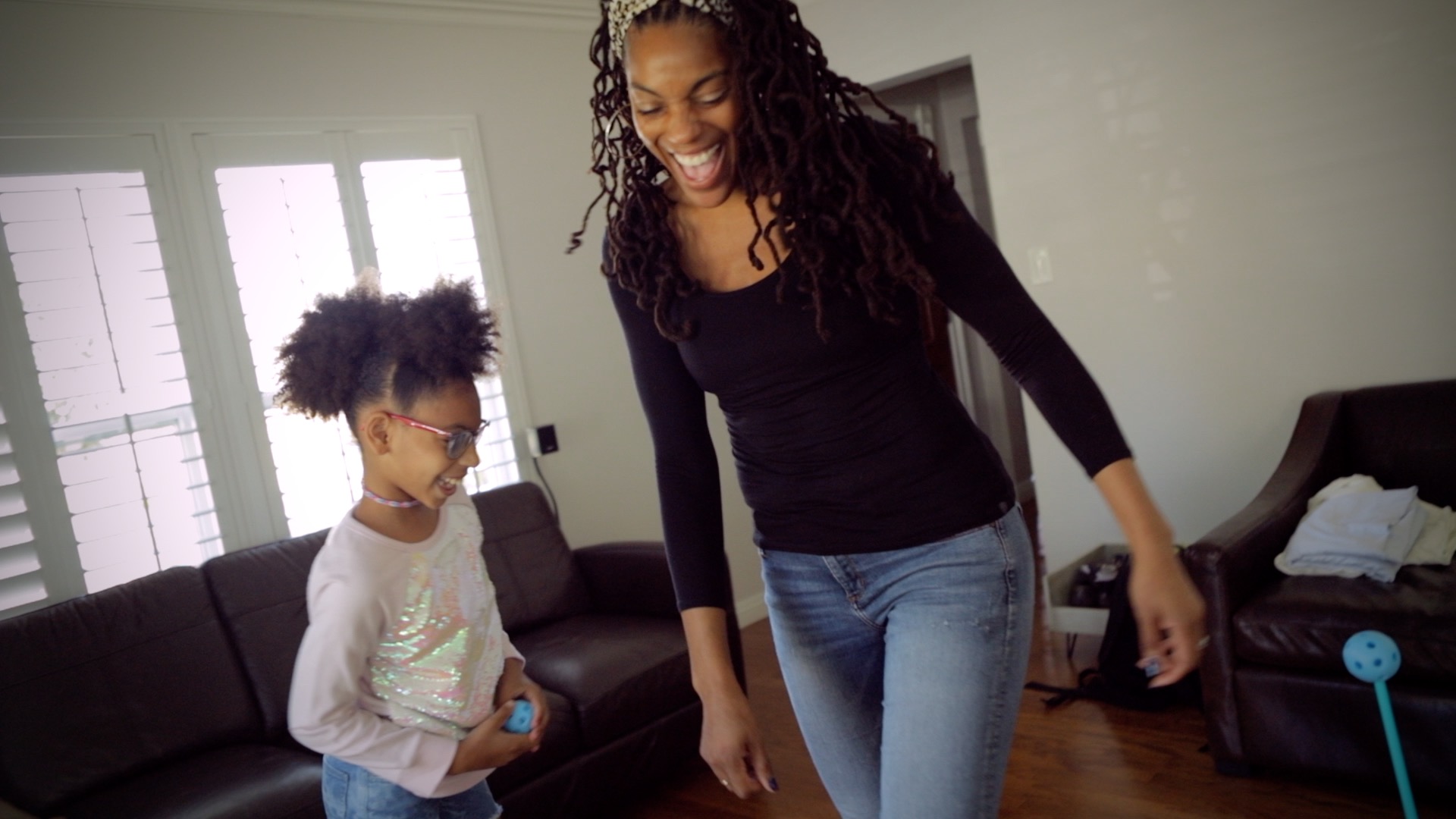 a mom and daughter laughing